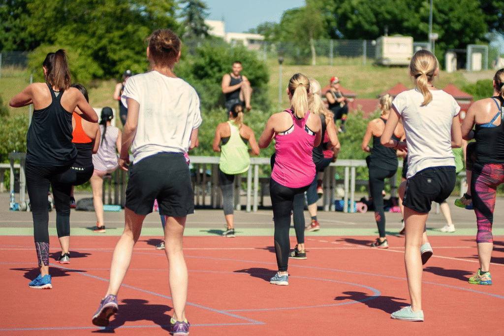 Outdoor group fitness class helping women over 40 stay active, build strength, and enjoy the full-body benefits of regular exercise.